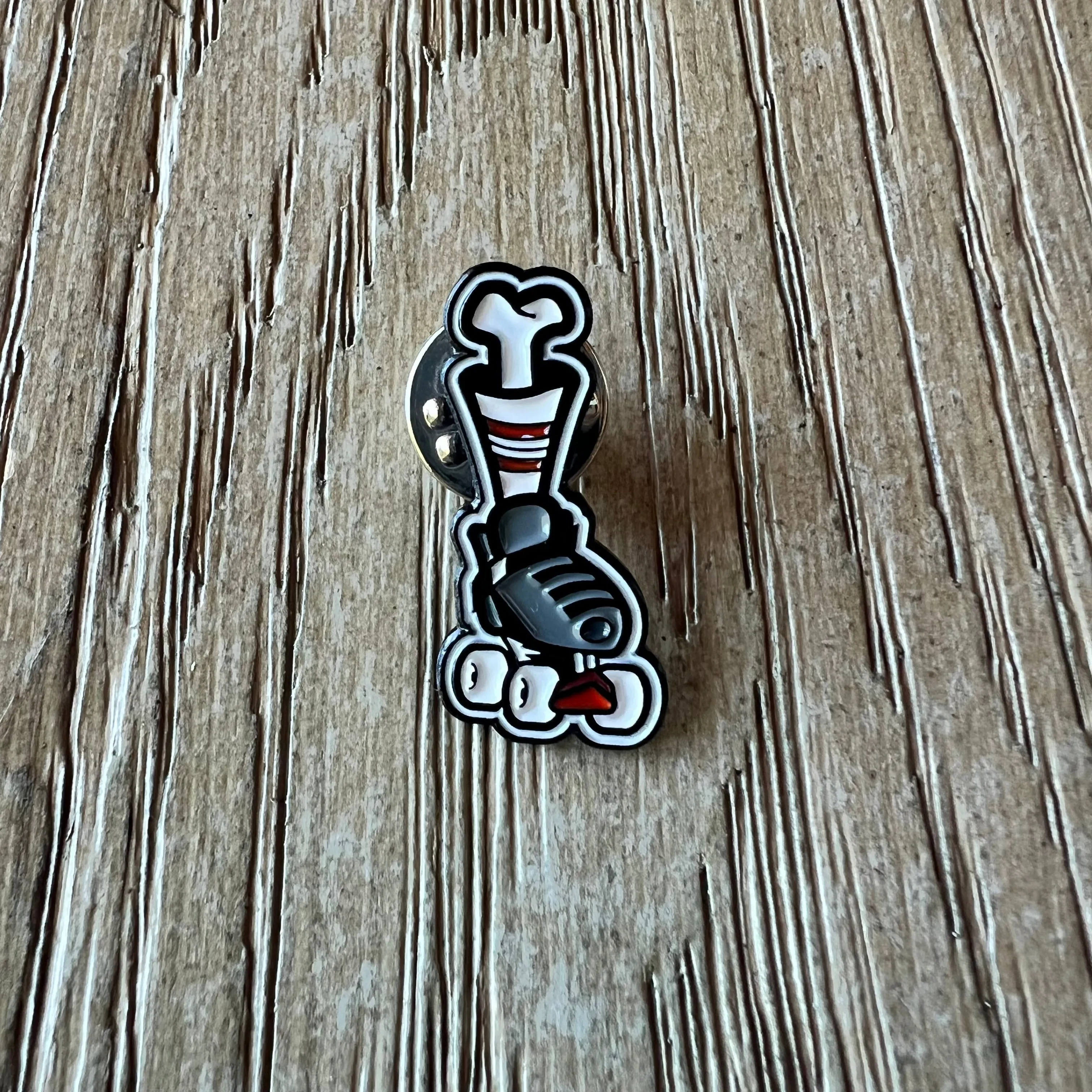 Leg Bone Roller Skate Enamel Pin